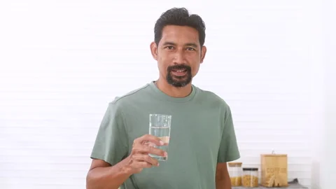 Indian middle-aged man, freelancer, male with mustache and beard drinking h.. Stock Footage 254691450