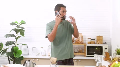 Indian middle-aged man, freelancer, male with mustache and beard drinking h.. Stock Footage 254692713