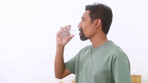Indian middle-aged man, freelancer, male with mustache and beard drinking h.. Stock Footage 254693298