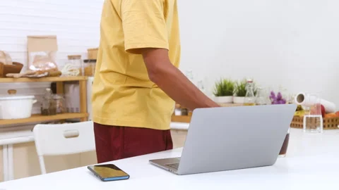 Indian middle-aged worker, freelancer working in domestic kitchen, single A.. Stock Footage 254749203