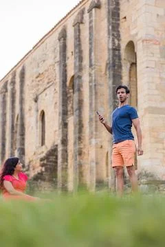Indian model, mature man dancing Bollywood with smartphone music. Europe travel Stock Photos