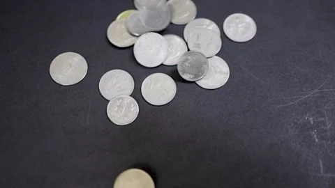 Indian monetary coins moving dynamically indicating fiscal stability and ma.. Stock Footage 318357645