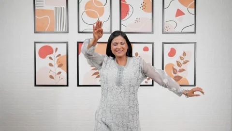 Indian mother dancing and doing bhangra Stock Footage 243749815