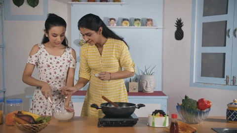 480px x 270px - Indian mother teaching cooking to her te... | Stock Video | Pond5