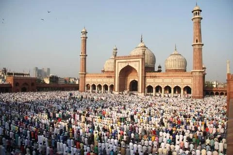 Indian Muslim devotees offer Eid al-Adha prayers at the Jama Masjid in New... Stock Photos