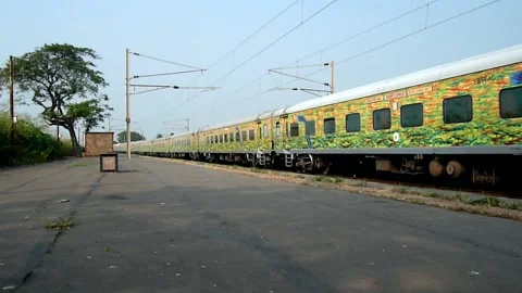Indian New Duronto Express Train Crossing Vaitarna Railway station Mumbai India Stock Footage 153167491
