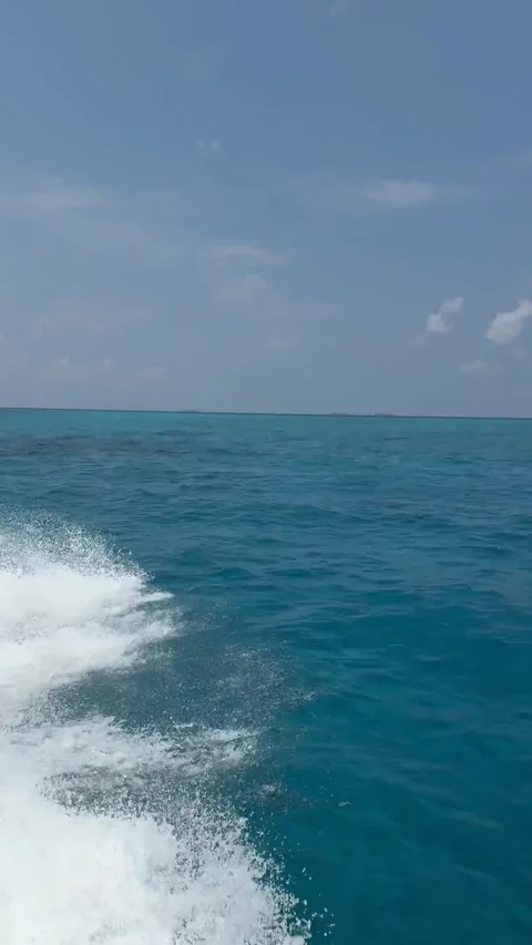 Indian Ocean water splashes from under a speedboat Video stock 309175672