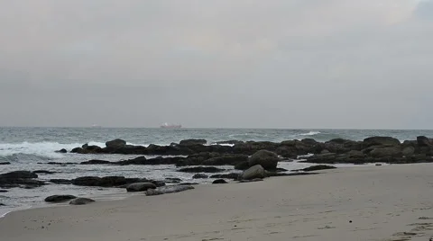 Indian Ocean with waves breaking on the rocks and beach in the foreground Stock-Footage 50938144