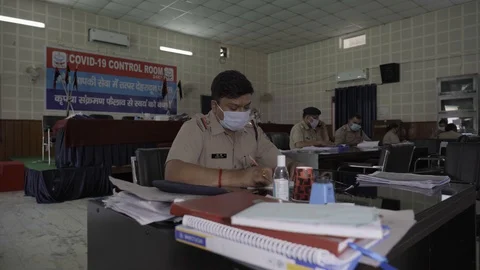 Indian paramilitary police forces helping people in covid 19 Coronavirus Stock Footage 128676367