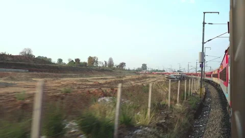 Indian passenger train moving on a curved railway track view from window Stock Footage 337544190