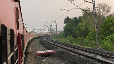 Indian Passenger Train Navigating Curved Railway Tracks POV Stock Photos