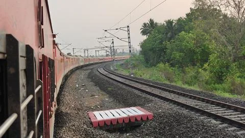 Indian Passenger Train Navigating Curved Railway Tracks POV Stock Photos