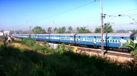 Indian passenger train passes by suburbs of Bangalore, Karnatak Stock Footage 20593137