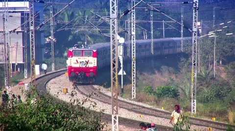 Indian passenger train passes by suburbs of Bangalore, Karnatak Stock Footage 20593256