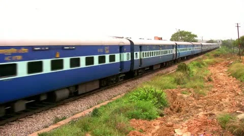 Indian passenger train passes by suburbs of Bangalore, Karnatak Stock Footage 20593310