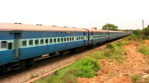 Indian passenger train passes by suburbs of Bangalore, Karnataka, India. Stock Footage 20604031