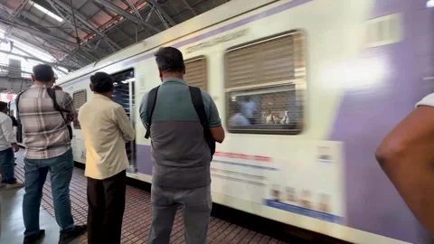 Indian Passengers Waiting for Local Train at Busy Railway Station Stock Footage 346197537