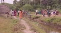Indian people gathered near a clay house HD Footage
