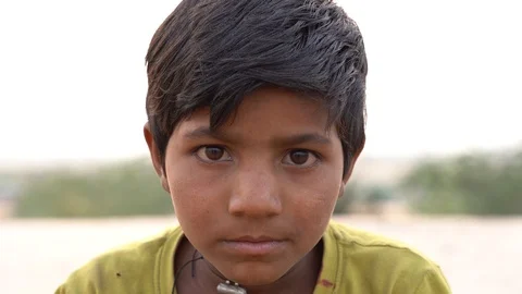Indian poor boy on time Pushkar Camel Mela, Rajasthan, India, closeup portrait Stock Footage 111775425