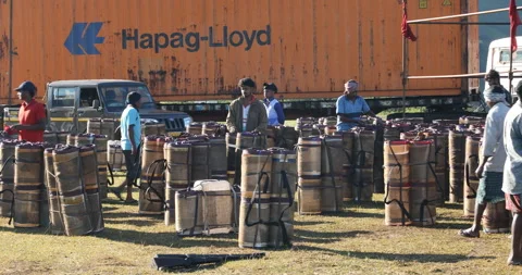 Indian Poor Male workers with Cans on Hill Stockbeeldmateriaal 326837924