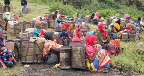 Indian Poor women workers with Cans on Hill Stock Footage 326731908