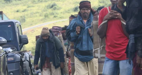 Indian Poor workers with Cans on Hill Stock Footage 326756133