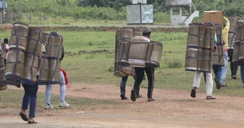 Indian Poor workers with Cans on Hill Video stock 326757903