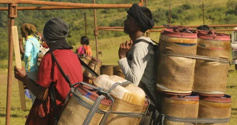 Indian Poor workers with Cans on Hill Stock Footage 326776760