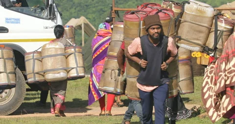 Indian Poor workers with Cans on Hill Stock Footage 326777032