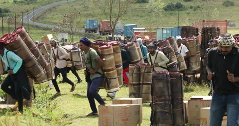 Indian Poor workers with Cans on Hill Stock Footage 327048881
