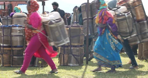Indian Poor workers with Cans on Hill Stock Footage 327054964