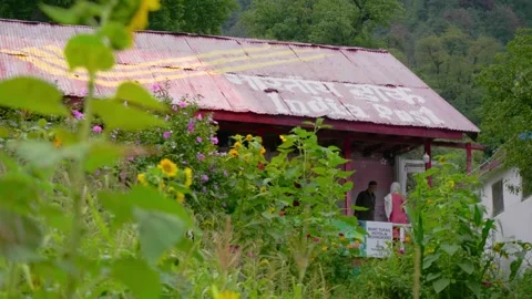 An Indian post office with sloped rooftop in the remote rural region Stock Footage 293291173