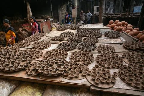 Indian potter makes earthen oil lamps for sale ahead of Diwali in Mumbai, India  Stock Photos