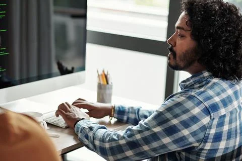 Indian Programmer Programming on Computer Stock Photos
