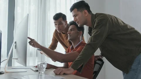 Indian Programmers Discussing Project on Computer in Office Stock Footage 203736078