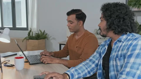 Indian Programmers Talking while Working on Computers Video stock 203732306