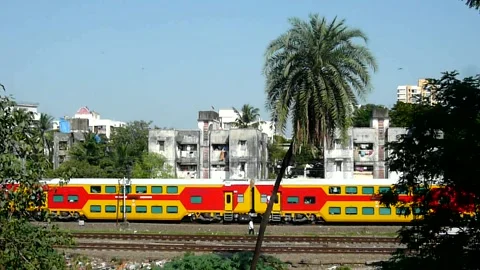 Indian Railways double Decker Express Train moving with speed Mumbai city India 스톡 동영상 136113748