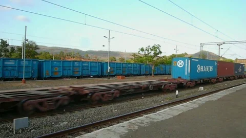 Indian railways empty wagon freight Train speed, Kaman road station Mumbai India Stock Footage 106344220