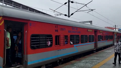 Indian Railways express train coach with open door at Vadodara station platform Stock Footage 345539740