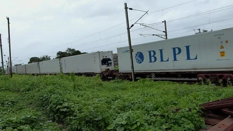 Indian railways Freight cargo container Train crossing station Maharashtra India Video stock 107462026