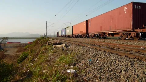 Indian railways Freight cargo container Train crossing sea bridge Mumbai India Stock Footage 131083806