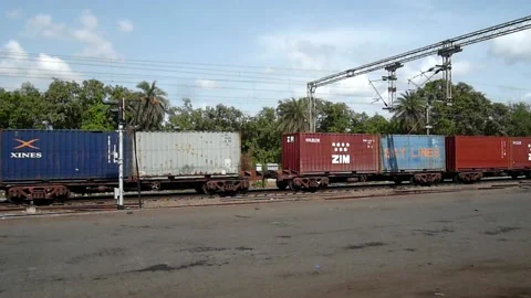 Indian Railways Freight cargo container Industrial Train moving at station India Stock Footage 136751055