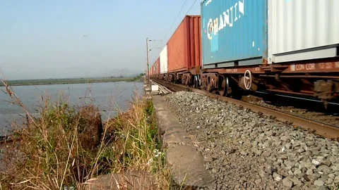 Indian railways Freight cargo container Train crossing sea bridge Mumbai India Stock Footage 153158613