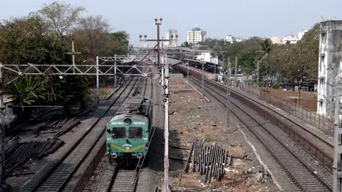 Indian Railways maintenance train engine cab moving near Mumbai station India Stock Footage 131808245