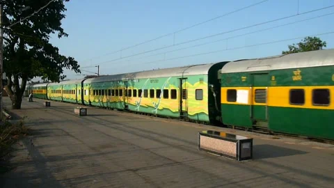 Indian railways New Express Train Crossing Vaitarna Railway station Mumbai India Video stock 153167062