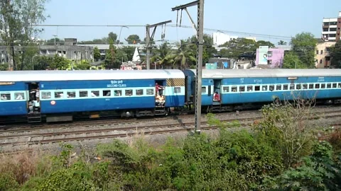 Indian Railways Passenger Express Train speed scenic landscape view Mumbai India Stock Footage 131097429