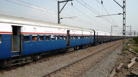 Indian railways Passenger express train moving at very good speed, Mumbai India Stock Footage 132988038