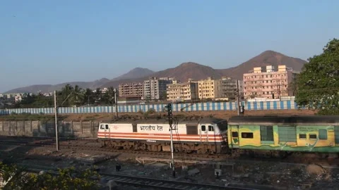 Indian Railways Passenger Express Train speeding Aerial view urban Mumbai India Video stock 133986941