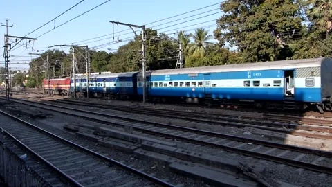 Indian railways Passenger express train moving speed urban city Mumbai India Stock Footage 133988217
