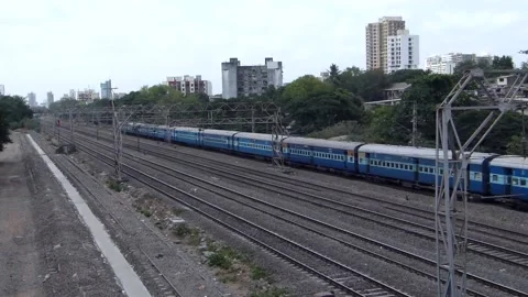 Indian Railways Passenger Express Train speeding Aerial view urban Mumbai India Stock Footage 135461356
